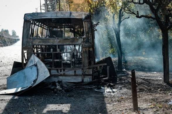 Russian guided bomb kills 30 near buses in Ukraine