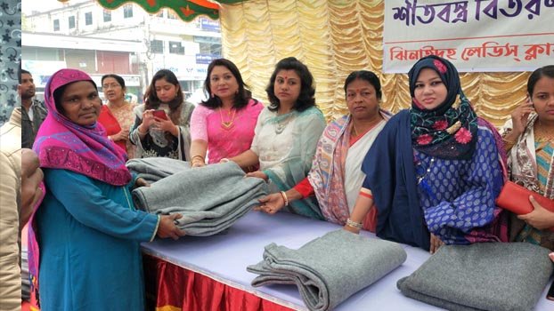 Ladies club distributes warm clothes among cold-hit women