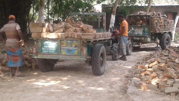 UP Chairman preserves bricks for 3 km road  at his home!