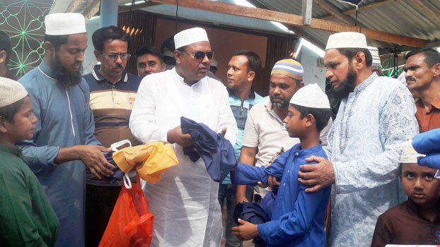 Birthday celebrated by distributing dress,  food among orphans