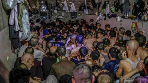 In packed, dirty cells, political prisoners fear virus