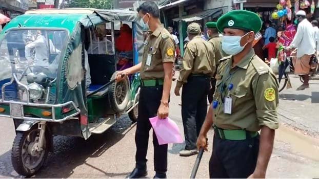 Ansar-VDP men working to enforce health guidelines in Jhenaidah