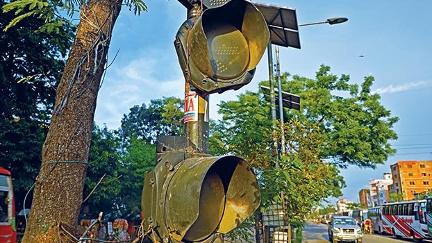 Automated traffic signals stand idle