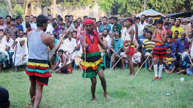 Hundreds of people enjoy traditional Lathikhela in Jhenaidah village