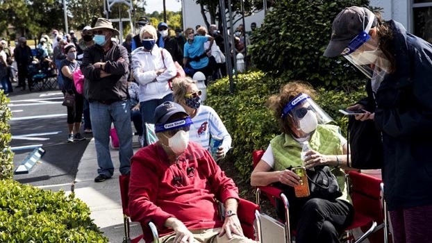 Race to vaccinate millions in US off to slow, messy start