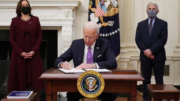 Biden orders masks, travel  clampdown in new war on Covid