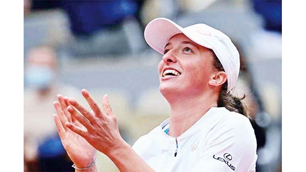 No pressure for French Open champ Swiatek in Australia 