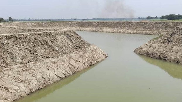 Illegally excavated pond being refilled in Lalpur