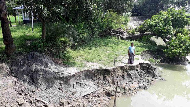 Debottar property being  devoured by pond 