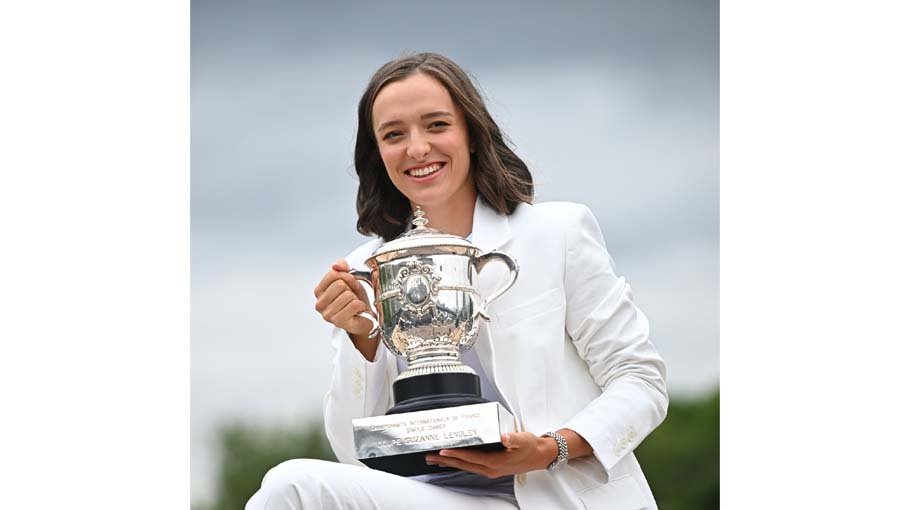 Rockin’ Rafa fan Swiatek on top of the world