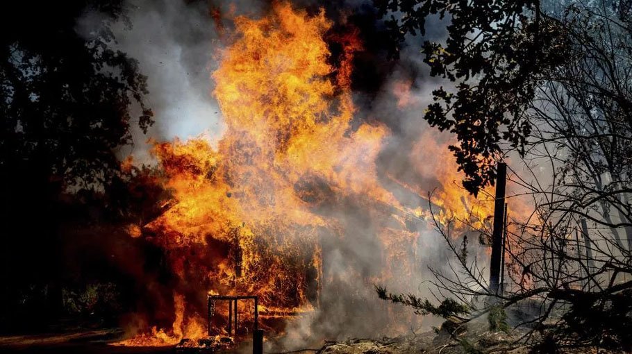 California wildfire rages as US bakes in record-setting heat wave