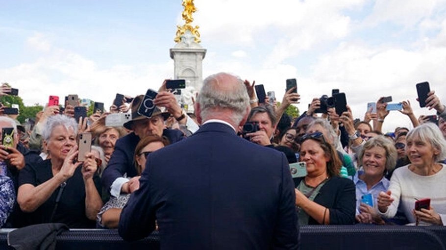 UK watches to see if king departs from mother’s traditions