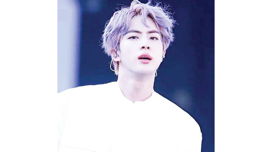 BTS' Jin sparks rumours of solo debut as he leaves for US