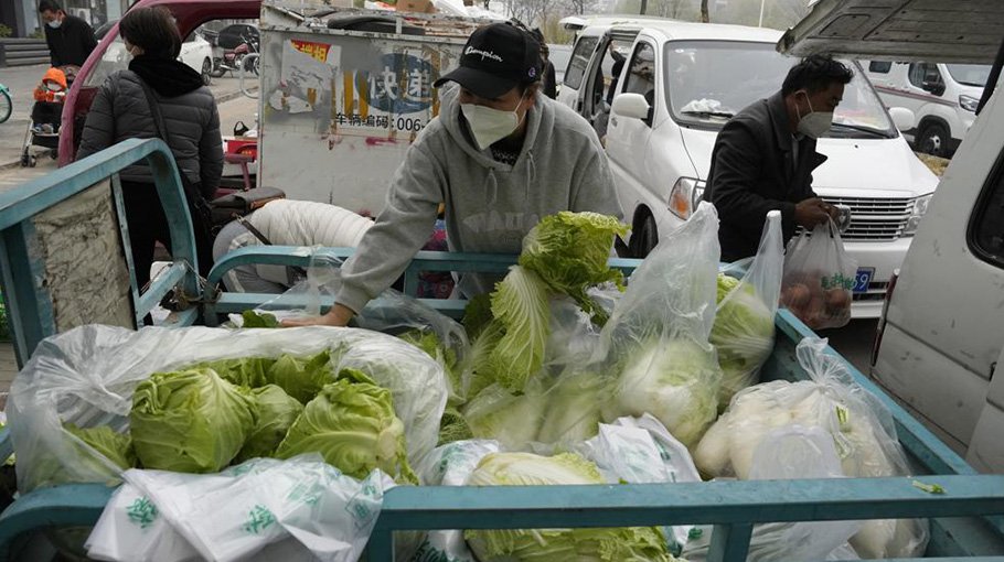China expands lockdowns as COVID-19 cases hit daily record