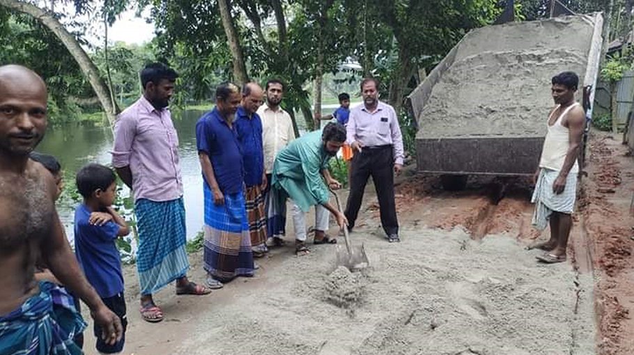 Locals repair road in Rowmari 