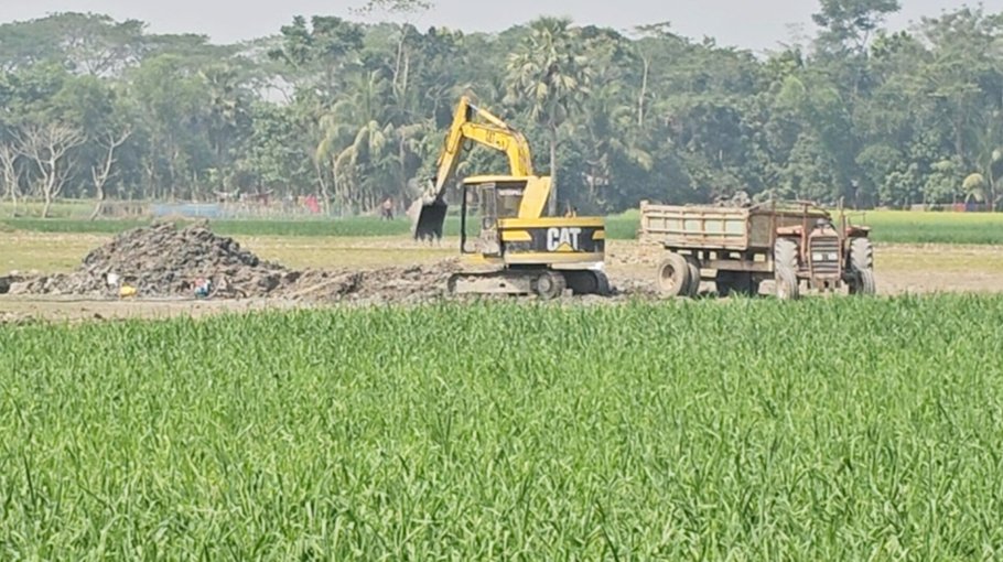 Extraction of soil from crop  fields in Madaripur alleged
