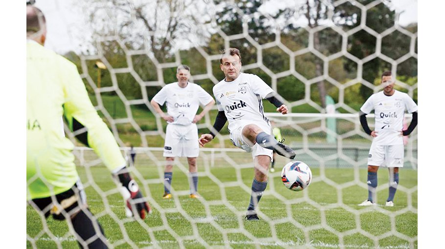 Macron scores penalty in charity match