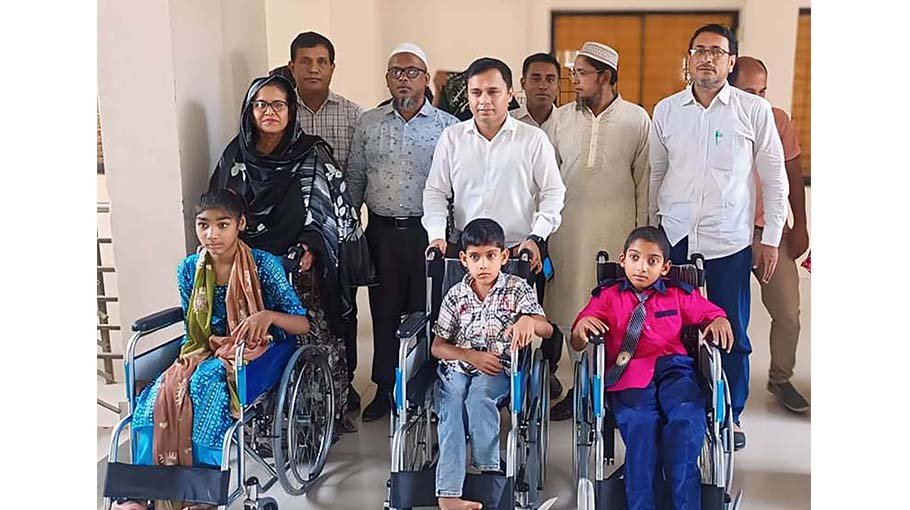 Wheelchairs distributed to special children in Madaripur