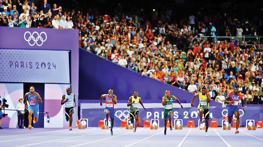 Lyles wins sensational 100m gold by 0.005 seconds