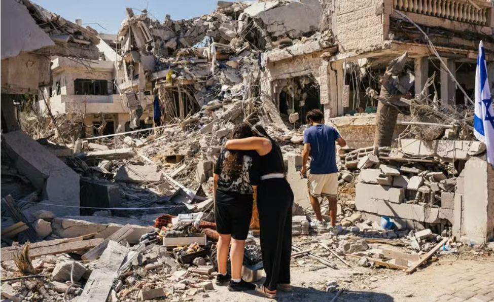 Destruction mounts as Iran’s missile strikes devastate central Israel