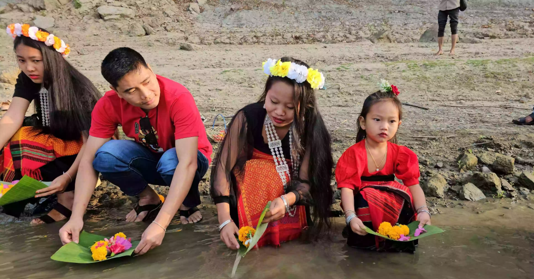 Biju, Bishu festivals begin in Bandarban with flower offerings in river